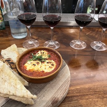 Sixty Vines - Featured above is the baked Ricotta and a flight of Red Wine. Best paired with the Round Pond Cab 2014. - New American Near Me - Dallas, Texas Sixty Vines - Featured above is the baked Ricotta and a flight of Red Wine. Best paired with the Round Pond Cab 2014. - New American Near Me - Dallas, Texas