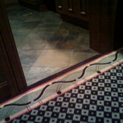The Crooked Billet - Floor in women's bathroom (checkered edged carpet and terracotta tiles) all in dark wood and low lighting