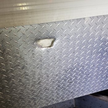 Chuy's Towing - Hole in the aluminum diamond plating on the front of the trailer. - Towing Near Me - Ceres, California