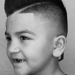 Low fade with hard part done by Richie