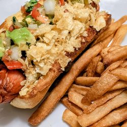 Hofmann Sausage Company - Hofman German Franks. Really delicious!Bacon-Wrapped with avocado pico and potato chips.
