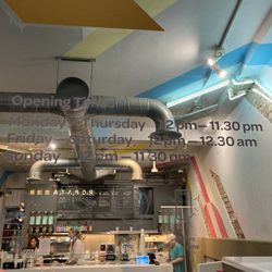 Biju Bubble Tea Room - Restaurant hours on door.