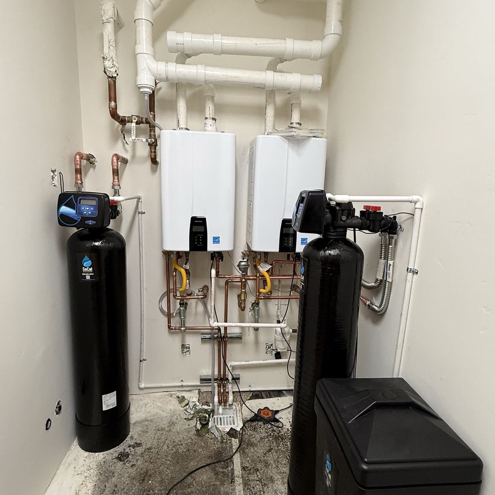 Whole house water filter left and soft water system on right Whole house water filter left and soft water system on right
