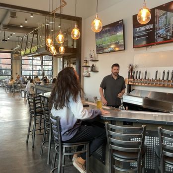 BLAKE Brewhouse & Distillery - Bar in front of the entrance, photo taken from side angle - Asian Fusion Near Me - Canmore, Alberta BLAKE Brewhouse & Distillery - Bar in front of the entrance, photo taken from side angle - Asian Fusion Near Me - Canmore, Alberta