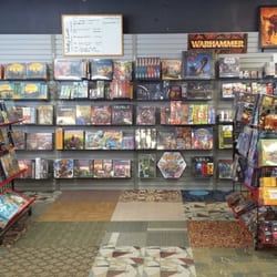 Misty Mountain Games - Left wall, plenty of board games.
