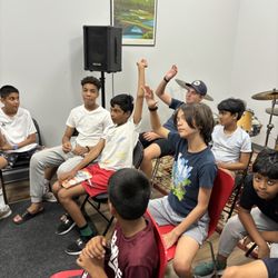 Tonal Art Music Center - Students participating in a songwriting class at Tonal Art Music Center in Jersey City, developing creativity, and original music