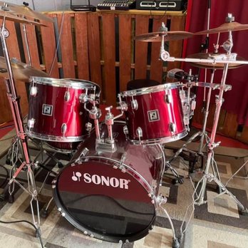 The Garage Restaurant & Bar - a red drum set - American Near Me - St. Albert, Alberta The Garage Restaurant & Bar - a red drum set - American Near Me - St. Albert, Alberta