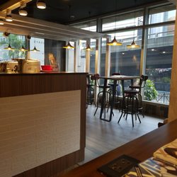 Owndays - They have a waiting area and serves coffee