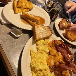 a breakfast of eggs, toast, bacon, and hash browns a breakfast of eggs, toast, bacon, and hash browns