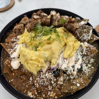Coco Maya - Jerk chicken Chilaquiles 1/2 red and 1/2 green sauce - Caribbean Near Me - San Diego, California Coco Maya - Jerk chicken Chilaquiles 1/2 red and 1/2 green sauce - Caribbean Near Me - San Diego, California