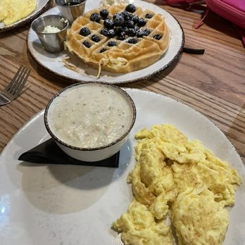 Young Cardinal Cafe - Blueberry waffle, eggs and some of the best dang grits I've ever had - Breakfast & Brunch Near Me - Winston-Salem, North Carolina