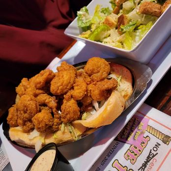 Fudpucker's - Shrimp po' boy and Ceasar salad - Seafood Near Me - Destin, Florida Fudpucker's - Shrimp po' boy and Ceasar salad - Seafood Near Me - Destin, Florida