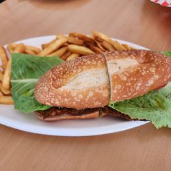 Furnos - Milanesa sandwich with fries.