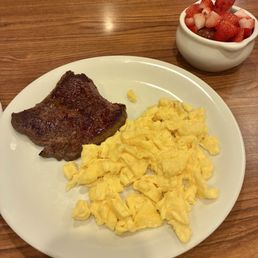 Sirloin Steak & Eggs (scrambled), with strawberries and grapes. Sirloin Steak & Eggs (scrambled), with strawberries and grapes.