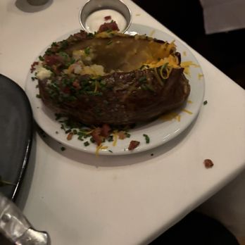 Gallagher's Steakhouse - Baked potato. I was starving so didn't remember the pic till mid meal - Steakhouses Near Me - Las Vegas, Nevada