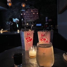 a drink and popcorn