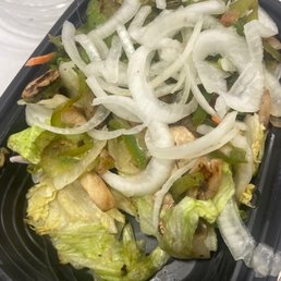 Spoiled brown lettuce and some veggies to cover up that it's spoiled. Spoiled brown lettuce and some veggies to cover up that it's spoiled.