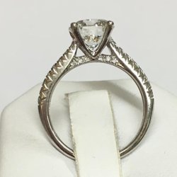 Trio Jewelers - Side view of 1.5 ct round full cut diamond with diamonds along shank