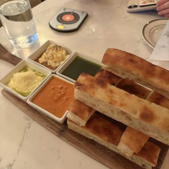 Jay Luigi - Daily bread with olive oil and herbs, pomodoro fondue, ricotta with honey, and butter with olive oil - Italian Near Me - St. Petersburg, Florida Jay Luigi - Daily bread with olive oil and herbs, pomodoro fondue, ricotta with honey, and butter with olive oil - Italian Near Me - St. Petersburg, Florida