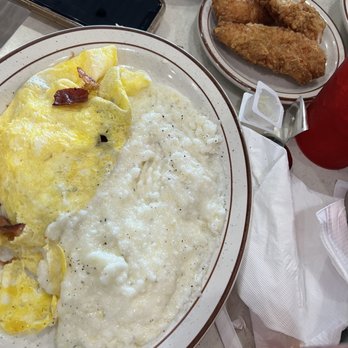 Loc's Chicken & Waffles - Bacon a Bacon & Cheese Omelette with grits - Breakfast & Brunch Near Me - Statesboro, Georgia Loc's Chicken & Waffles - Bacon a Bacon & Cheese Omelette with grits - Breakfast & Brunch Near Me - Statesboro, Georgia
