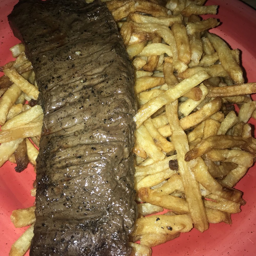 The Smith - Medium-rare skirt steak on a bed of fries to-go - New American Near Me - Washington, DC, District of Columbia The Smith - Medium-rare skirt steak on a bed of fries to-go - New American Near Me - Washington, DC, District of Columbia