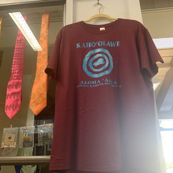 Aunty’s Leis & Little Things - a t - shirt hanging in a shop window - Gift Shops Near Me - Kualapuu, Hawaii