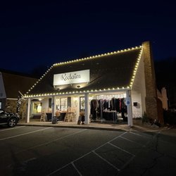 Reclaim Professional Organizing & Lifestyle - Exterior view from the left side at dusk; featuring seasonal Christmas lights.