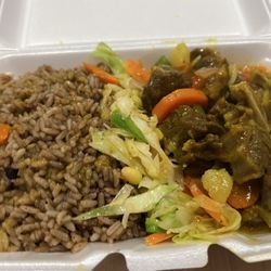 One Love Cuisine - Curry goat, rice and peas and cabbage.