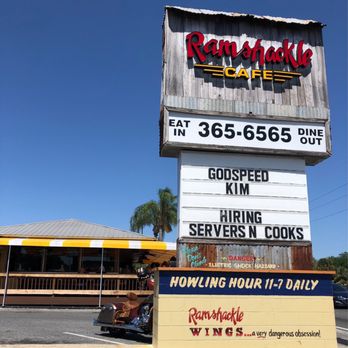 Ramshackle Cafe - Welcome sign and see the outdoor porch seating choice. - American Near Me - Leesburg, Florida