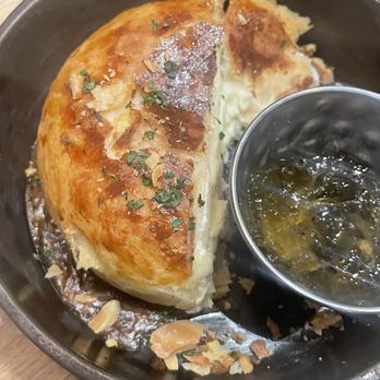 Cooper's on the Creek - Brie baked in puff pastry with pepper jam - New American Near Me - Georgetown, Colorado Cooper's on the Creek - Brie baked in puff pastry with pepper jam - New American Near Me - Georgetown, Colorado