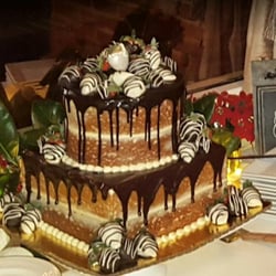 Flour Child Cakery - Yellow semi-naked cake with chocolate ganache and strawberry filling...YUM!