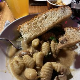 Gnocchi with Mushroom.  Tasty snd savory with fresh sourdough bread and greens.