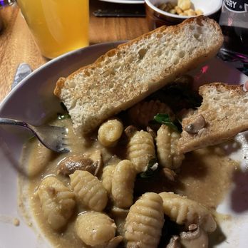 Blind Shot Social Club - Gnocchi with Mushroom.  Tasty snd savory with fresh sourdough bread and greens. - Social Clubs Near Me - Madison, Wisconsin