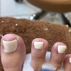 Elysian Nail and Spa - Completely clipped off the right side of my nail on the "pointer" toe..