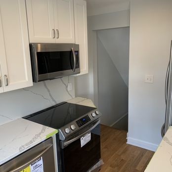FJ Contractors - a kitchen with stainless steel appliances - General Contractors Near Me