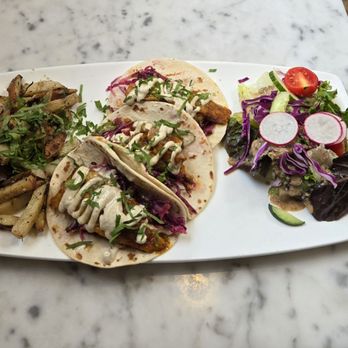 Epice - Barramundi Tacos- Blackened Barramundi, Cucumber Slaw, 7 Spice Aioli with Baked Potatoes and Salad. Delicious!! - Lebanese Near Me - Nashville, Tennessee Epice - Barramundi Tacos- Blackened Barramundi, Cucumber Slaw, 7 Spice Aioli with Baked Potatoes and Salad. Delicious!! - Lebanese Near Me - Nashville, Tennessee