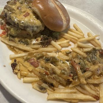 Chuy's - Green Chile Burger with queso and fries smothered in queso and green chile - Mexican Near Me - San Antonio, Texas