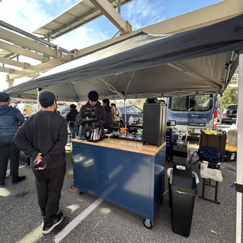 Moonwake Coffee Roasters - a group of people standing under a tent - Coffee Roasteries Near Me - San Jose, California Moonwake Coffee Roasters - a group of people standing under a tent - Coffee Roasteries Near Me - San Jose, California