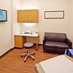 MedSpring Urgent Care - Exam rooms with flat screen TV, couch and Wi-Fi