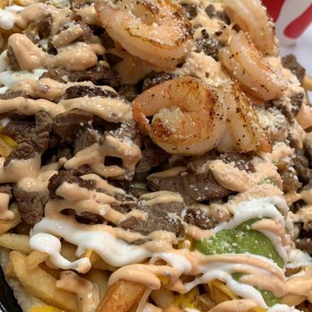 Taco Man Grill - Fries with shrimp and carne asada topped with guacamole sour cream and some cheese layered on a flour tortilla - Mexican Near Me - Henderson, Nevada Taco Man Grill - Fries with shrimp and carne asada topped with guacamole sour cream and some cheese layered on a flour tortilla - Mexican Near Me - Henderson, Nevada
