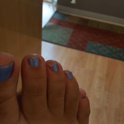 Nail Spa - Nails uncut and old polish still visible.