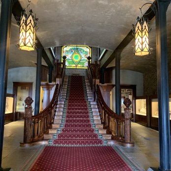 Inglenook - a staircase leading to a stained glass window - Wineries Near Me - Rutherford, California