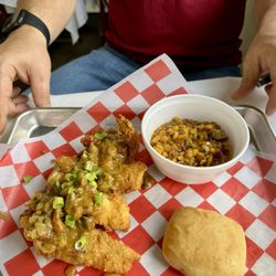 Chris Specialty Foods - Fried catfish strips topped with crawfish etouffee