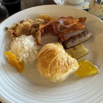 100 Sails Restaurant & Bar - Buffet breakfast staples, prince fried rice, croissant , bacon , sausage, rice  and a couple of tater tots - Buffets Near Me - Honolulu, Hawaii