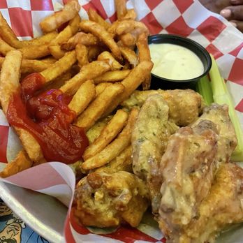 Black Market Bar + Grill - Garlic pepper wings and fries - Bars Near Me - Birmingham, Alabama Black Market Bar + Grill - Garlic pepper wings and fries - Bars Near Me - Birmingham, Alabama