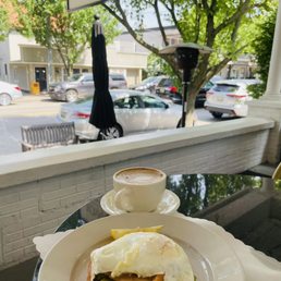 Cafe Miel and Avocado Toast with Smoked Salmon and runny egg on the patio Cafe Miel and Avocado Toast with Smoked Salmon and runny egg on the patio