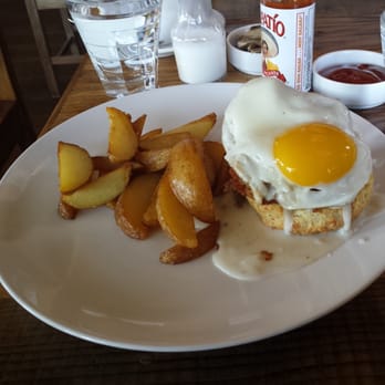 The Table - Fried chicken with cheddar biscuit, sausage gravy, fried egg and side of potato wedges. - New American Near Me - San Jose, California The Table - Fried chicken with cheddar biscuit, sausage gravy, fried egg and side of potato wedges. - New American Near Me - San Jose, California