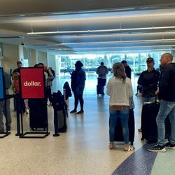 Dollar Rent A Car - Crowd waiting at 12:33P