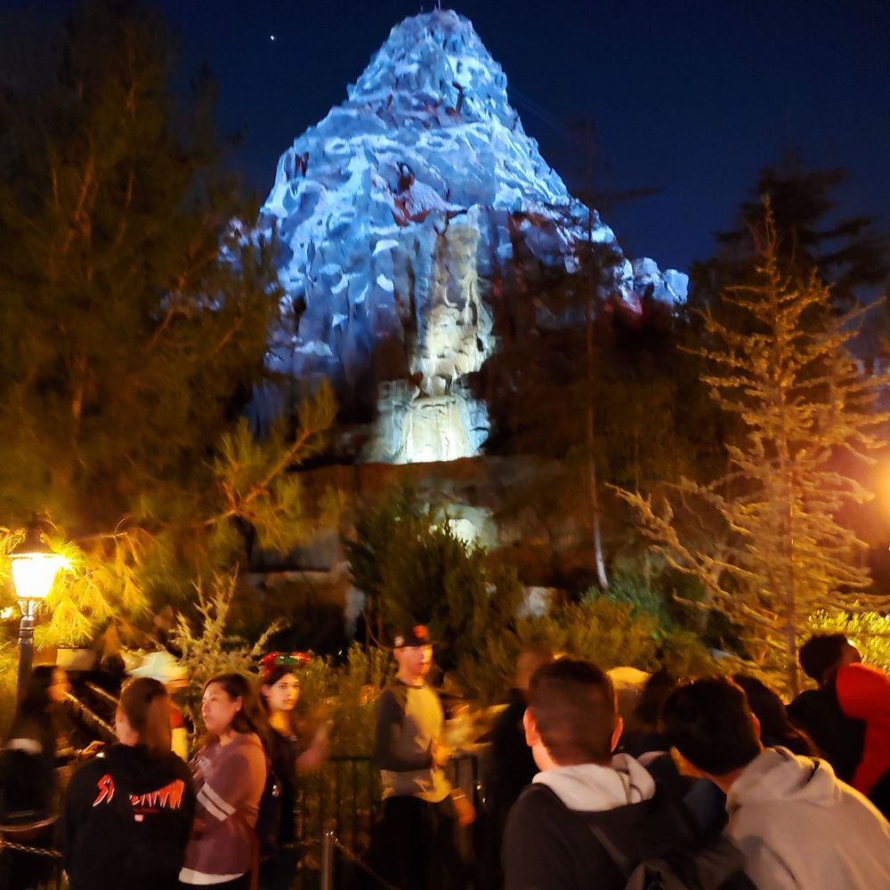 Matterhorn Bobsleds - Matterhorn lit up at night, it's so pretty! From my room at Disney's Grand Californian Hotel, I can see the Matterhorn. - Amusement Parks Near Me - Anaheim, California