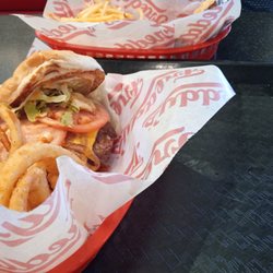 Freddy's Frozen Custard & Steakburgers - CA style burger with onion rings